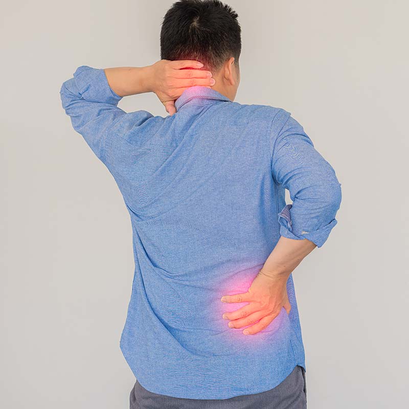 Man with lumbar and neck pain with red notes rubbing his painful